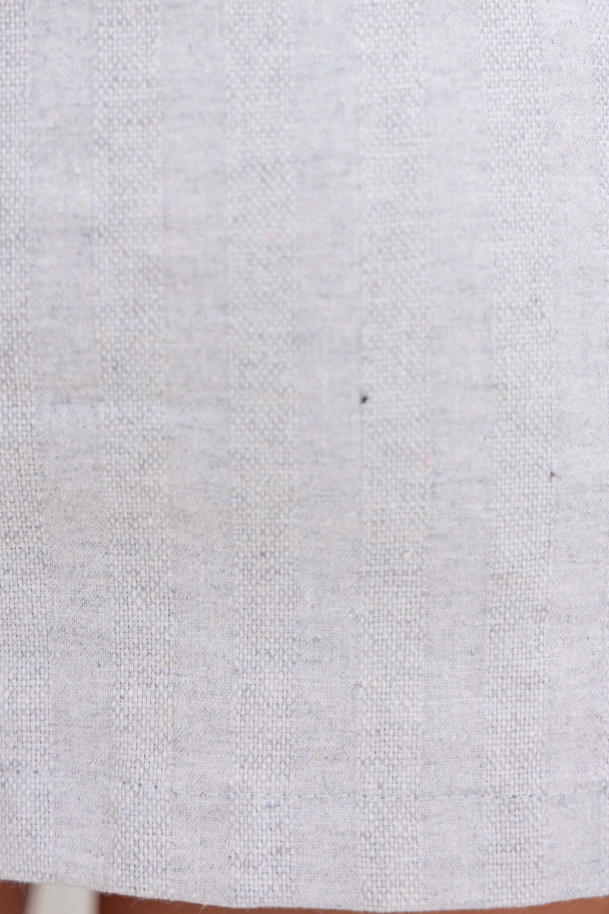 Close-up of Hudson Skirt fabric in light grey color, showcasing textured pattern and soft cotton material.