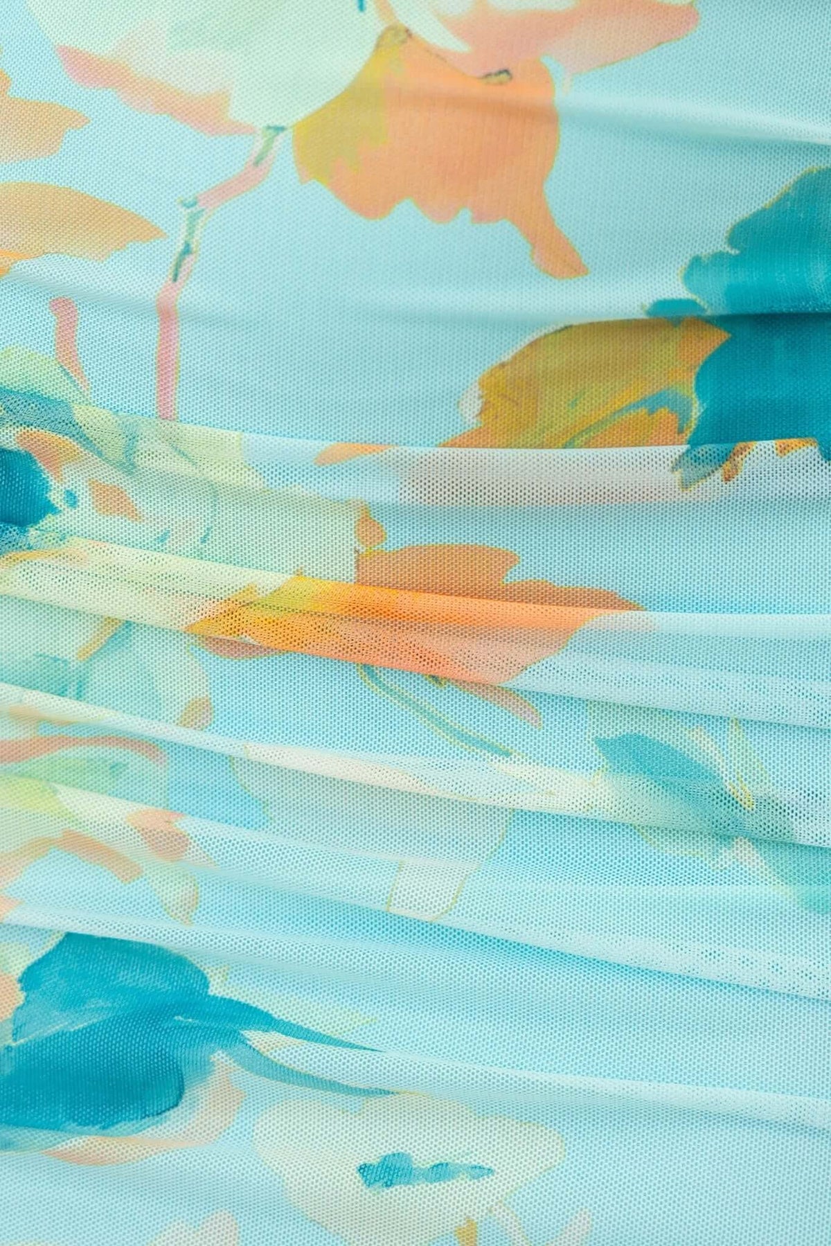 Close-up of the floral mesh overlay on the Stolen Kiss Maxi Dress in soft pastel colors.