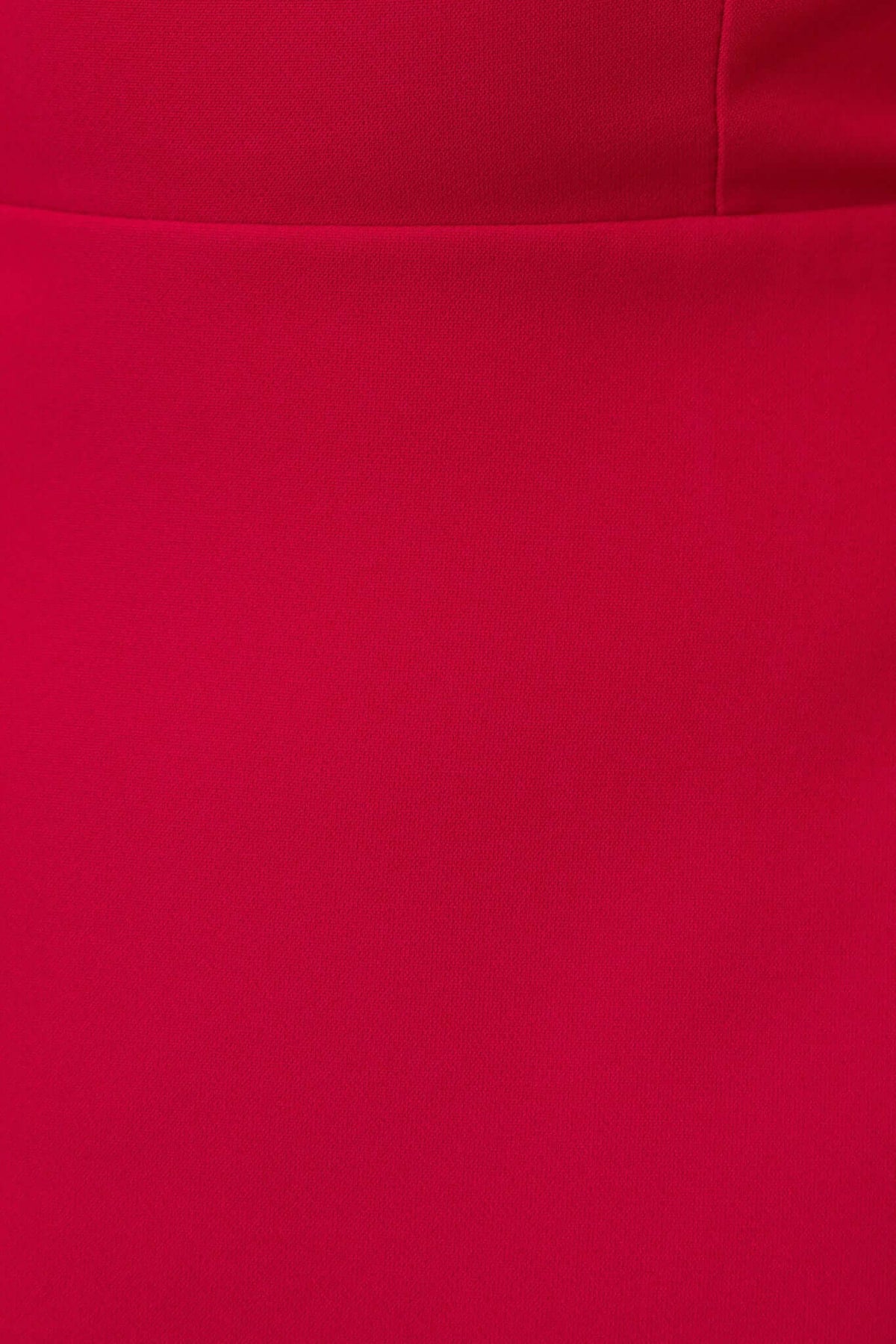 Close-up of the vibrant red fabric of the Fallow Dress, showcasing its smooth texture and rich color.