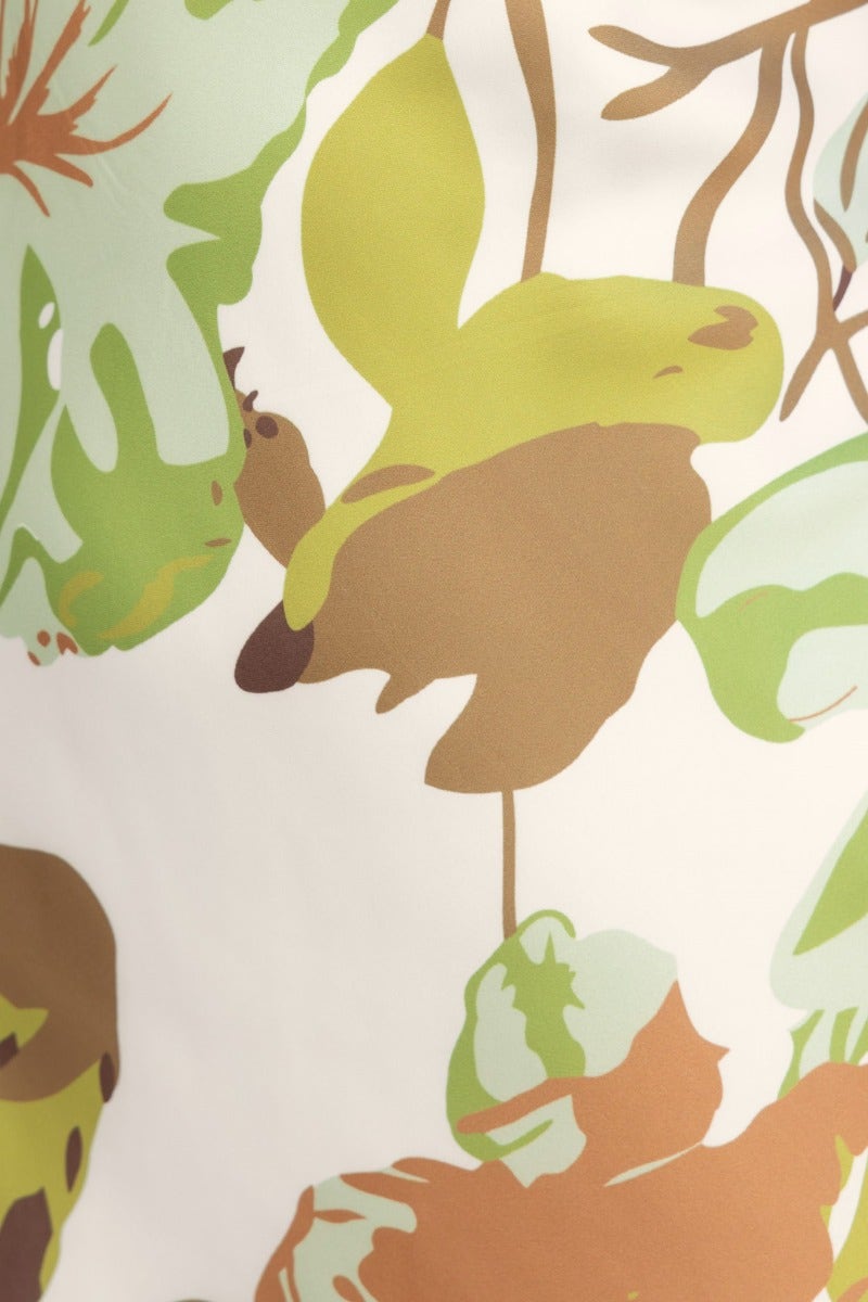Close-up of vibrant floral print on Brylee Maxi Dress featuring green and brown tones.