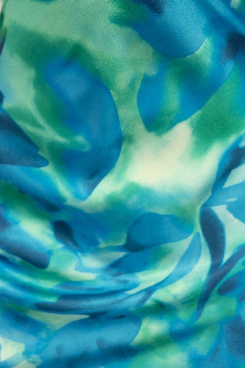 Close-up of blue and green watercolor pattern on satin fabric of Look Within Maxi Dress.