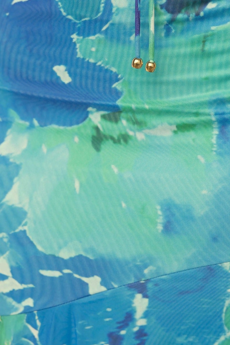 Close-up of the Pisces Maxi Dress featuring a multi-colour design with vibrant blue and green shades.