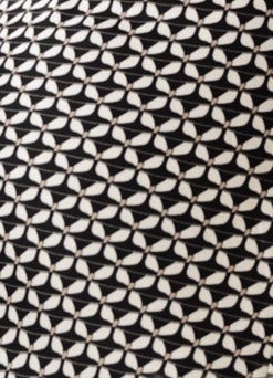 Close-up of a black and white patterned fabric with a geometric design.