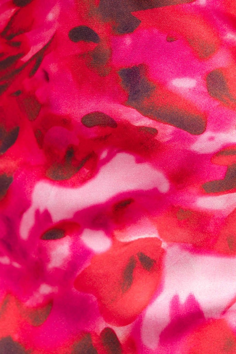 Close-up of vibrant pink and red floral fabric, perfect for the Look Within Maxi Dress.