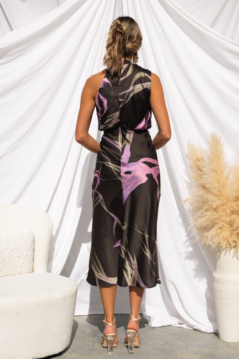 Back view of Irisse Midi Dress in floral print, showcasing high neckline and elegant silhouette.