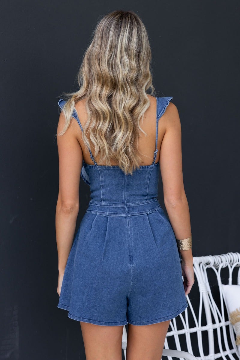 Back view of a Natty Denim Playsuit featuring adjustable straps and a stylish denim finish.