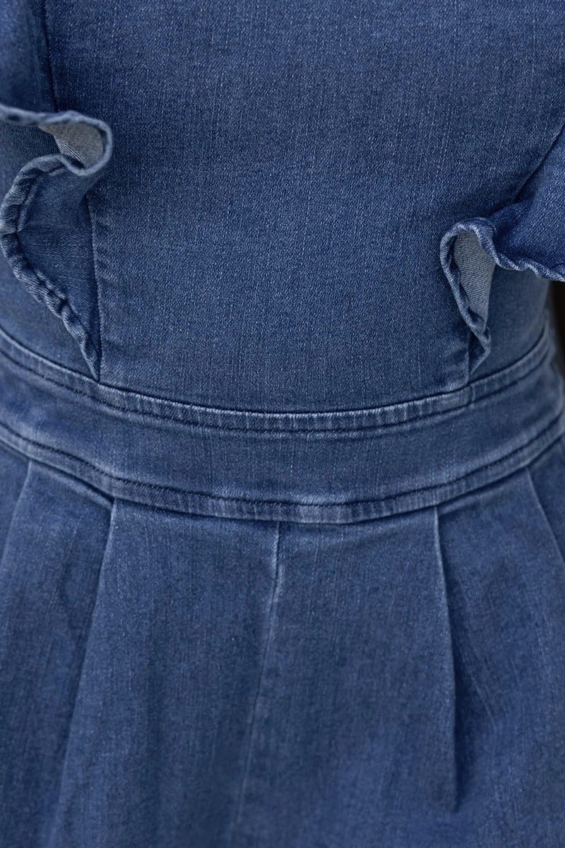 Close-up of Natty Denim Playsuit showcasing adjustable straps and denim texture.