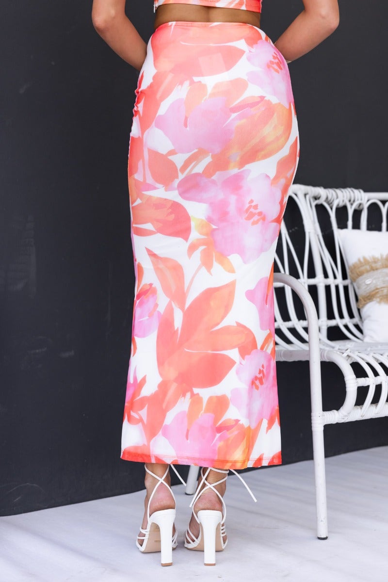 Gisella maxi skirt with floral mesh overlay, showcasing a feminine fit and comfortable elastic waistband.