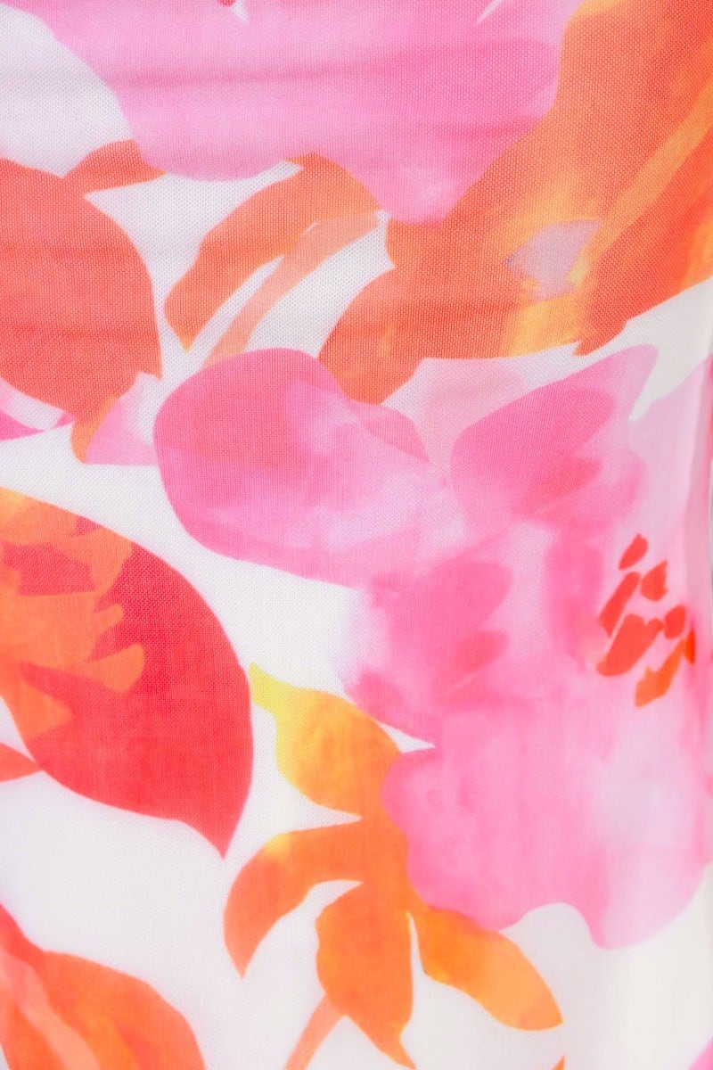 Close-up of vibrant pink and orange floral print on lightweight fabric for Gisella Top.