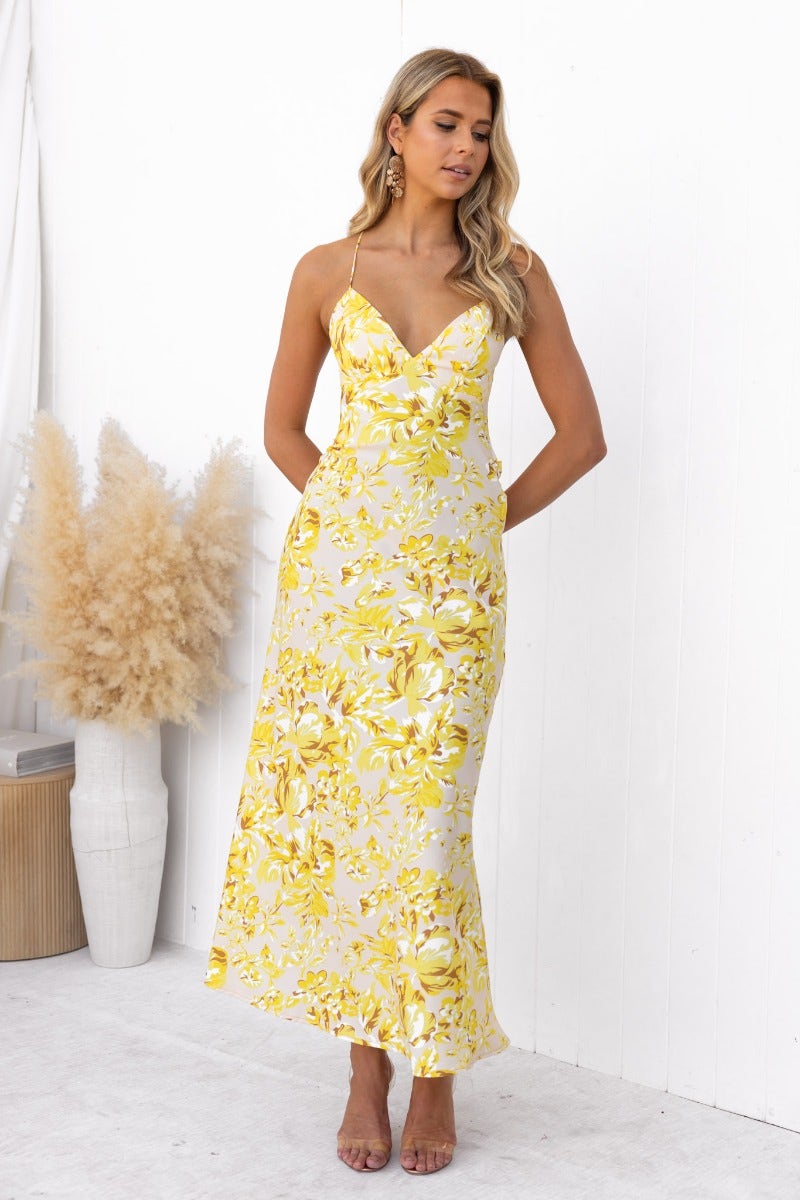 Floral print Ambra Maxi Dress with adjustable straps, featuring draping material and a side zip, perfect for summer occasions.