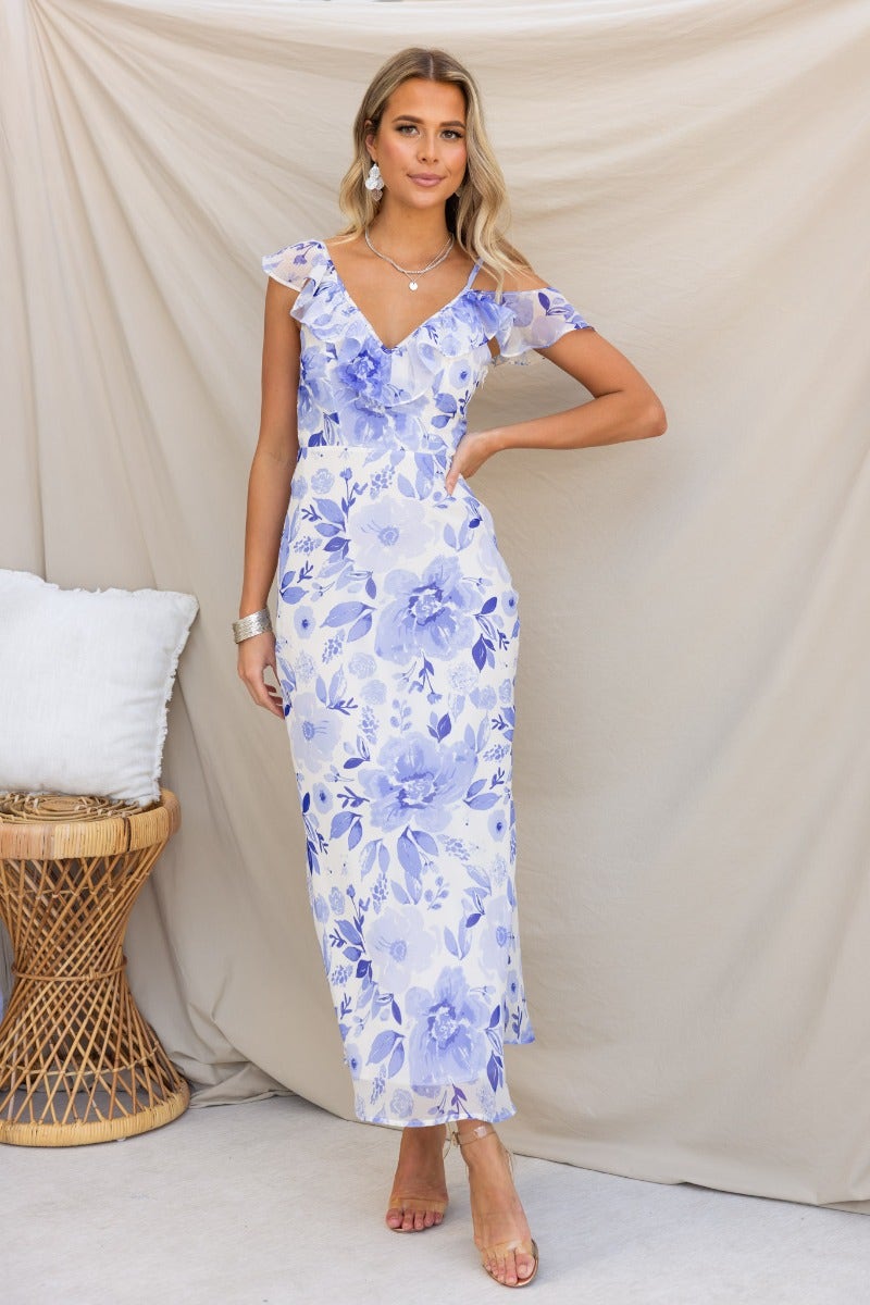 Janelle Maxi Dress in floral print, featuring adjustable straps, ruffle detail, and side zip for a stylish summer look.
