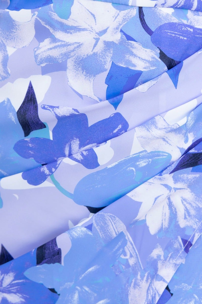 Close-up of floral print in shades of blue for a vacation-ready maxi dress with a vibrant, stylish design.