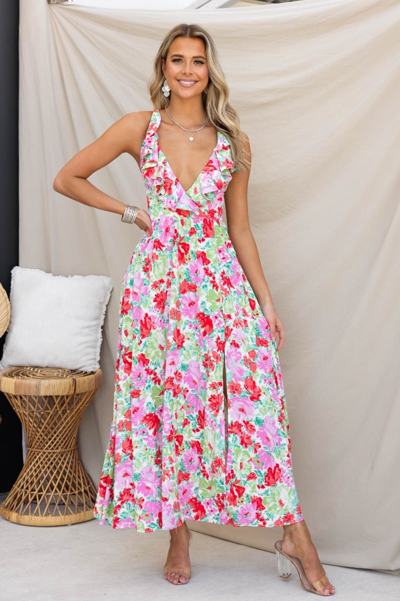 Floral print Swish Maxi Dress with V-neckline and split, model showcase with tie straps and boho decor.