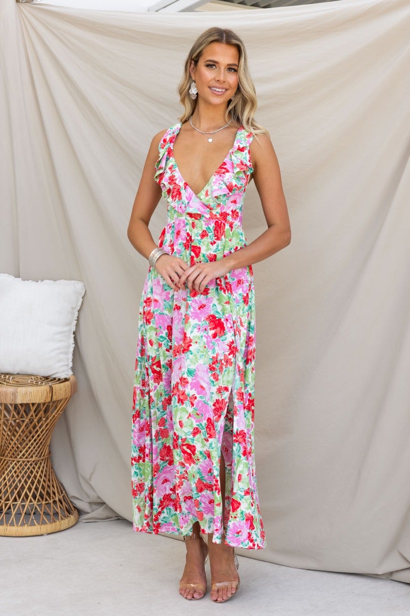 Model wearing a floral print Swish Maxi Dress with V-neckline and adjustable tie straps.