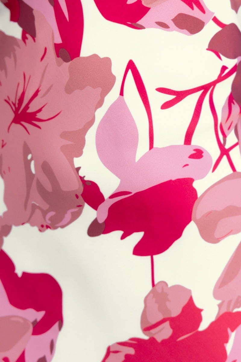 Close-up of vibrant pink floral pattern on fabric, perfect for a trendy Brylee Maxi Dress.