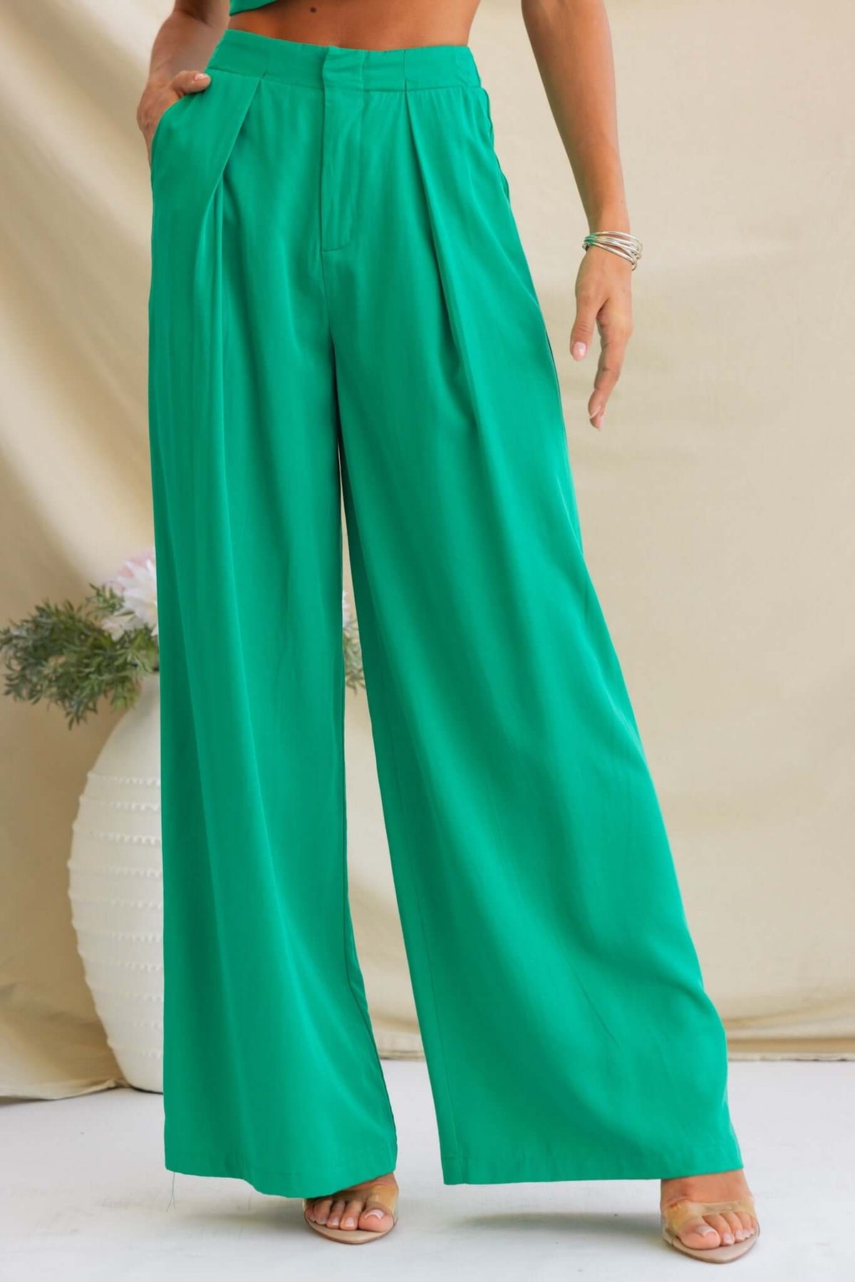 Erik Pants showcasing a vibrant green color, mid-high waist fit, and wide-leg design with hip pockets.