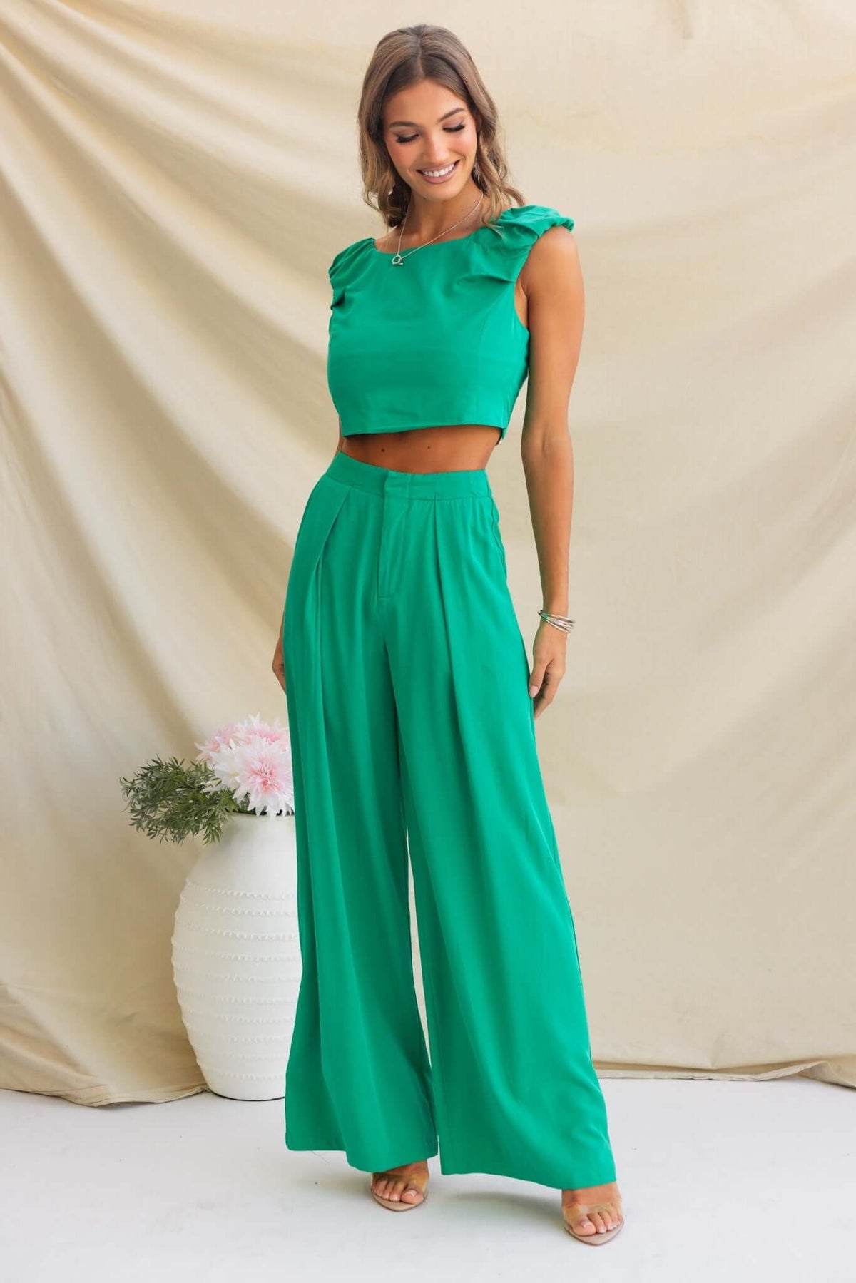 Model wearing green Erik Pants with a cropped top, showcasing a trendy mid-high waist fit and flowy design.