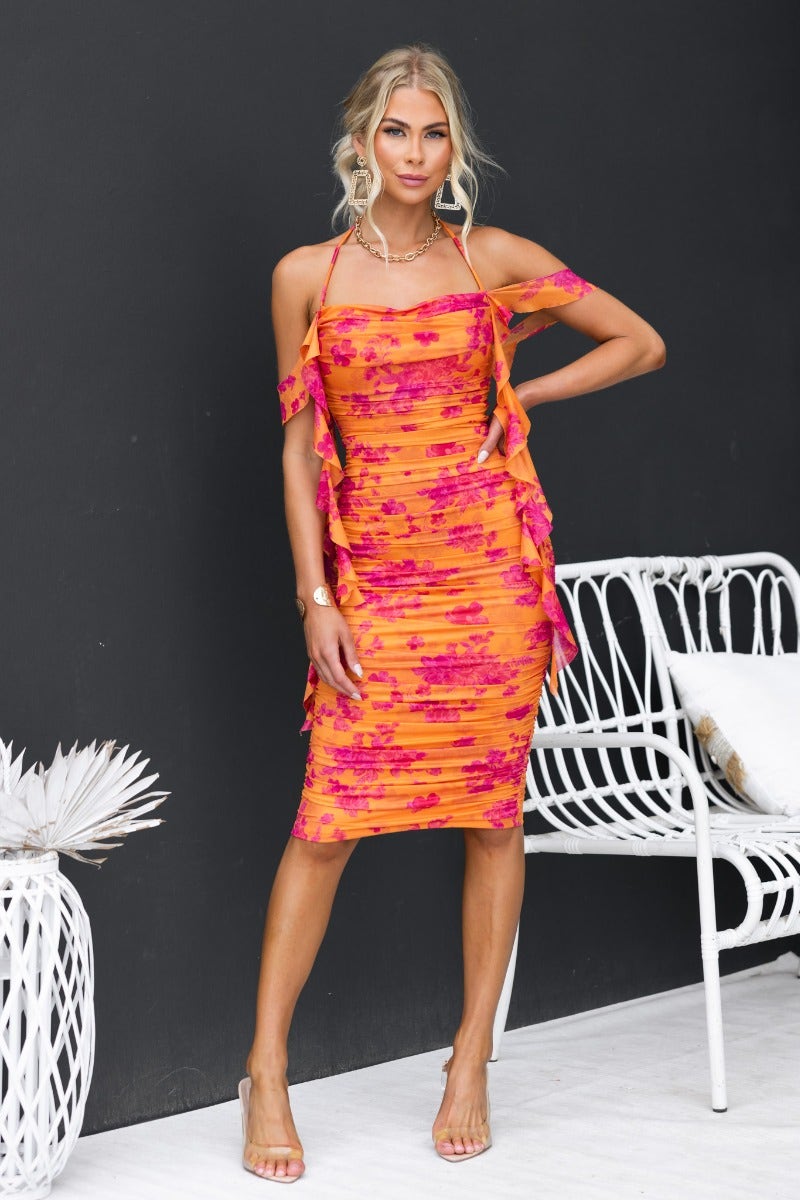 Dayania Midi Dress in vibrant floral print with adjustable ties, ruching, and mesh overlay. Model wearing size 6/XS.