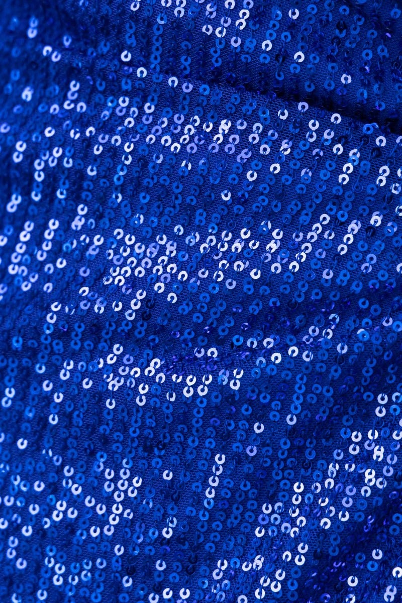 Close-up of shimmering blue sequin fabric, showcasing intricate patterns and textures perfect for glam dresses.