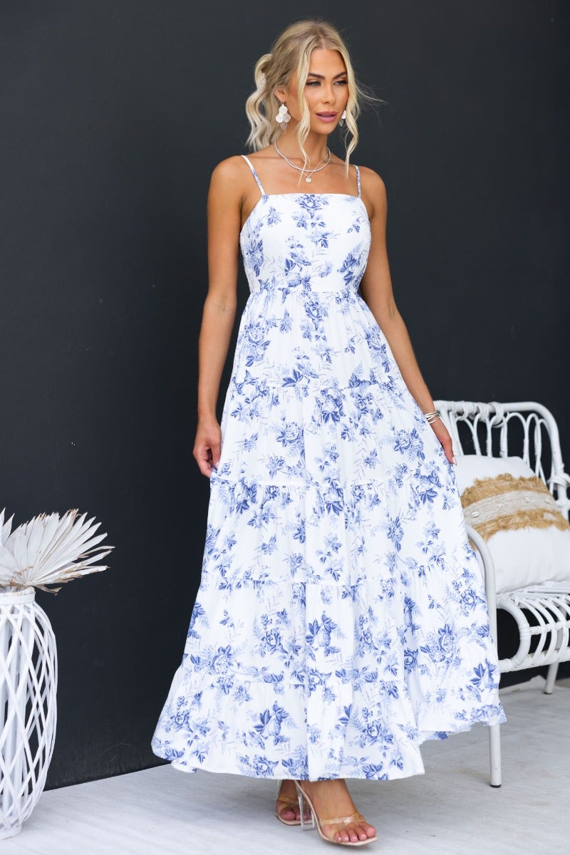 Model wearing Morea Maxi Dress, a floral print maxi dress with square neckline and adjustable straps.