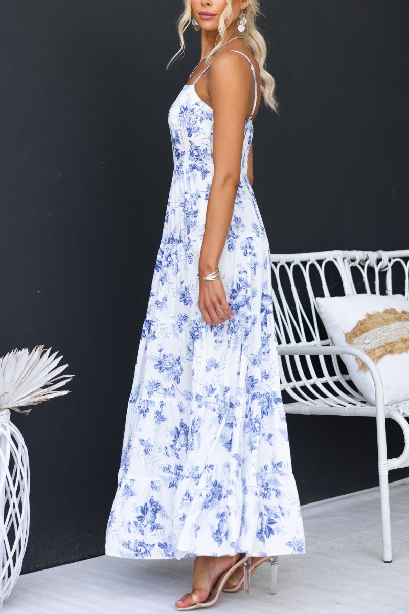 Floral print Morea maxi dress with adjustable straps and side pockets, model wearing size 8/S against dark backdrop.