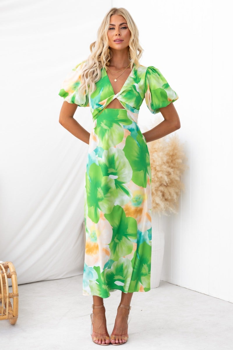 Stylish Qeilor Midi Dress featuring vibrant floral print, V-neckline, puff sleeves, and a cut-out under bust.