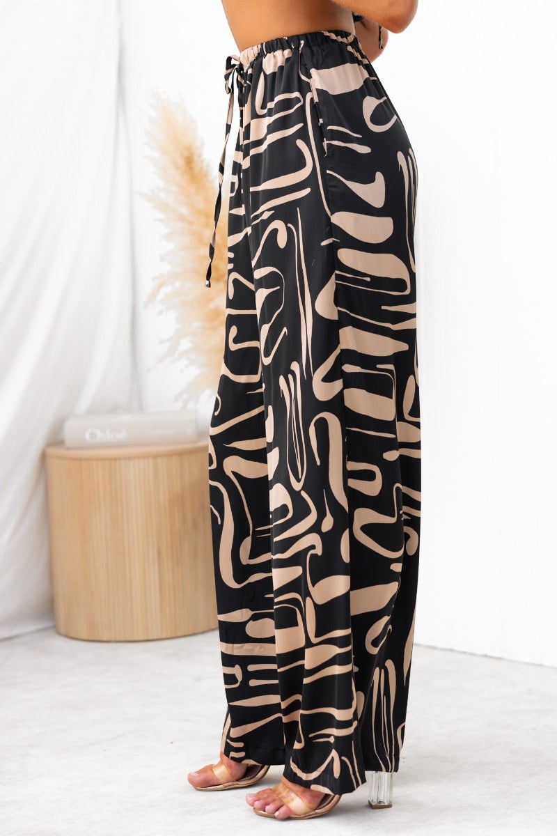 Up All Night Set black print pants with mid-high waist and elastic waistband, styled with a halter top.