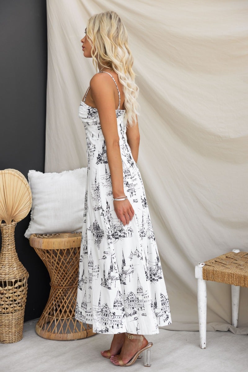 Side view of a woman wearing the Herston Maxi Dress featuring an abstract print and adjustable straps.