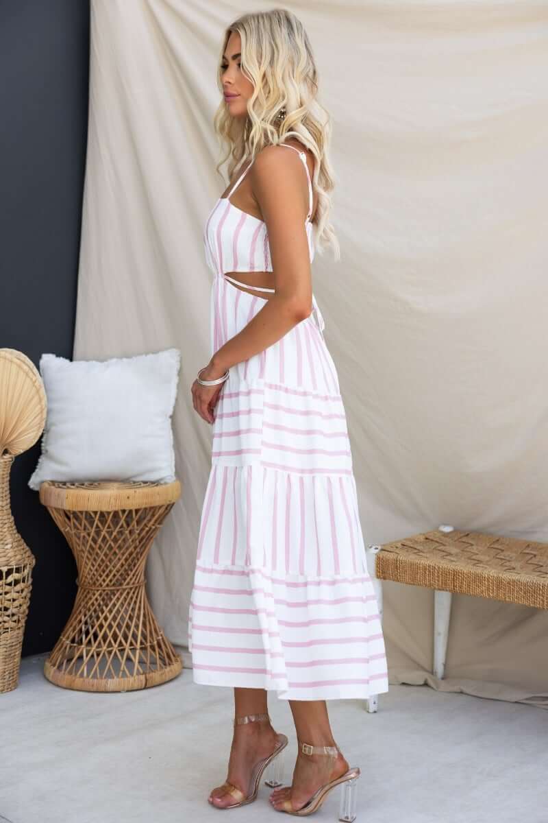 Side view of Brookman Midi Dress featuring adjustable straps, cut-out waist, and striped linen design.