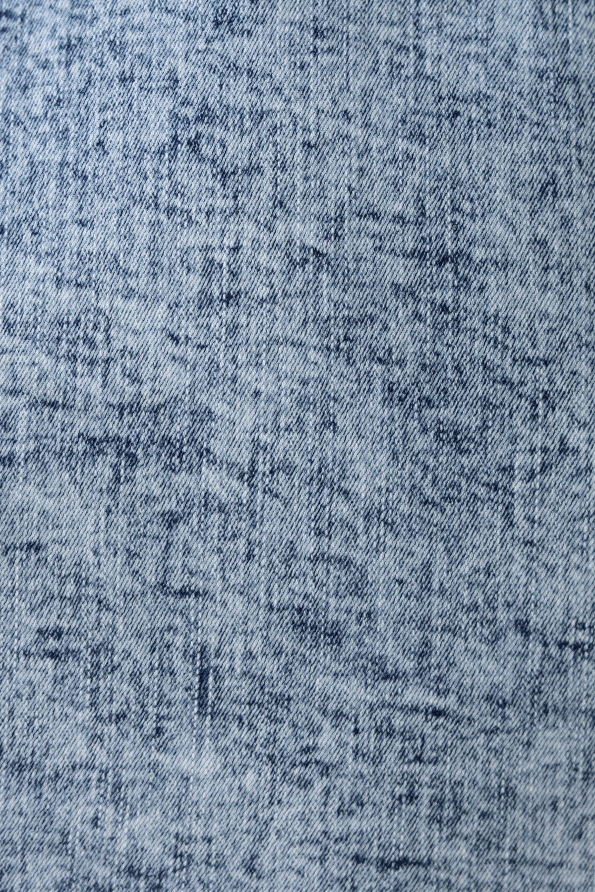 Close-up of soft blue denim fabric texture, ideal for casual wear and stylish clothing.