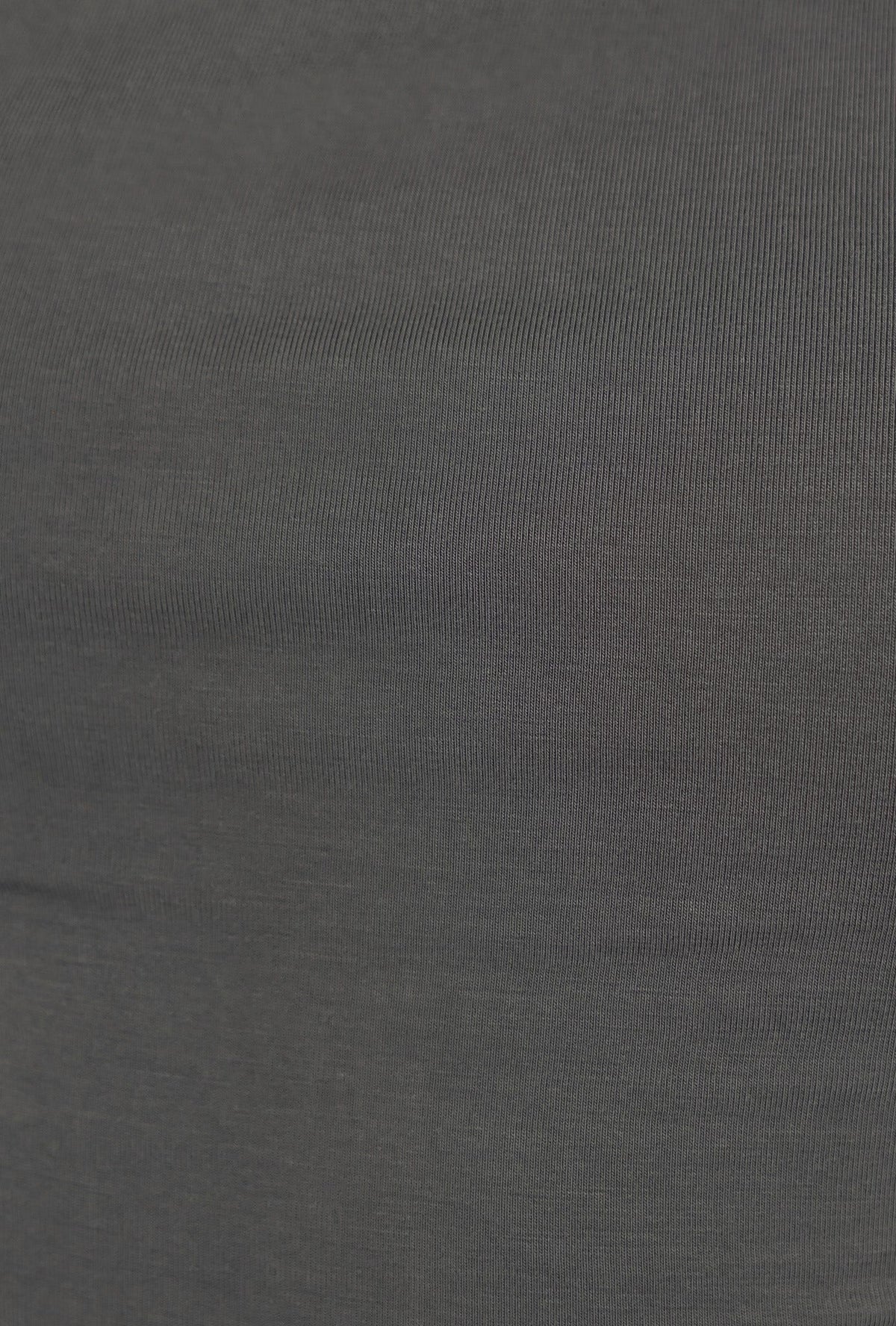 Close-up of the slinky stretch fabric in a dark green, showcasing its softness and smooth texture.