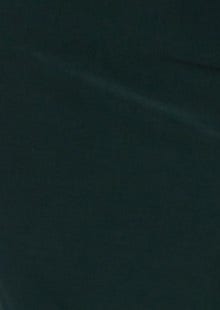 Dark green crepe fabric texture showcasing the material of the Raquel Midi Dress.