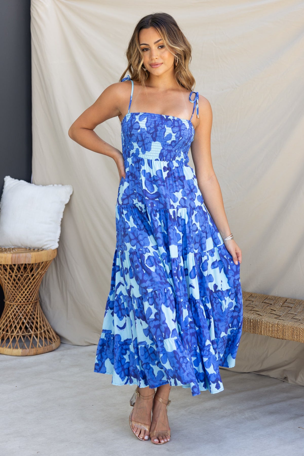 Model wearing the Inessa Midi Dress, a multi-colour midi dress with adjustable tie straps and a flowing silhouette.