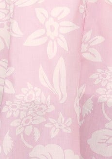 Close-up of pink floral print fabric featuring white botanical designs for Corio Midi Dress