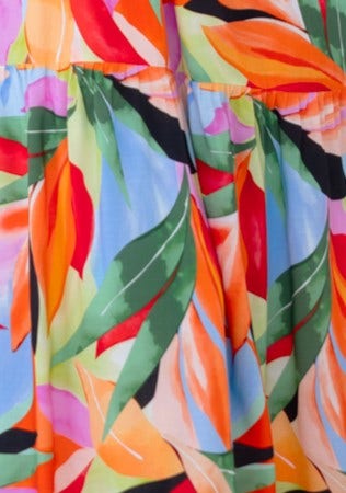 Close-up of vibrant floral print fabric featuring leaves and colorful patterns for Lemi Midi Dress.