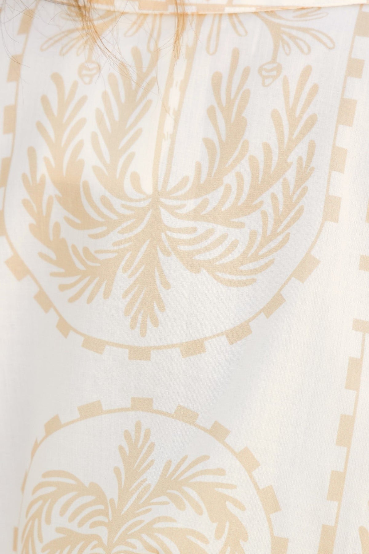 Detail of floral pattern on the fabric of the Alli Playsuit in light cotton, showcasing its elegant design.