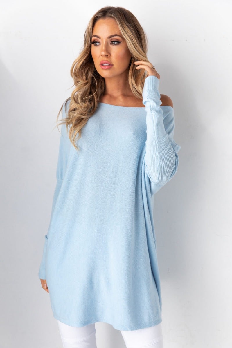 Model wearing a cosy oversized Bonnie Knit top in light blue, showcasing full length sleeves and comfortable fit.