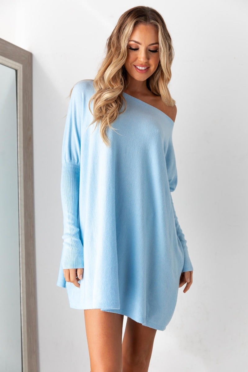 Cosy oversized Bonnie Knit dress in light blue, featuring full length sleeves and soft, stretchy cotton fabric.