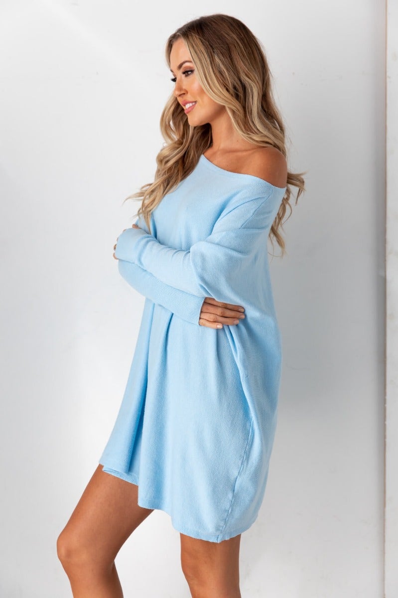 Cosy oversized Bonnie Knit dress in blue with full length sleeves, showcasing a relaxed fit and soft cotton material.