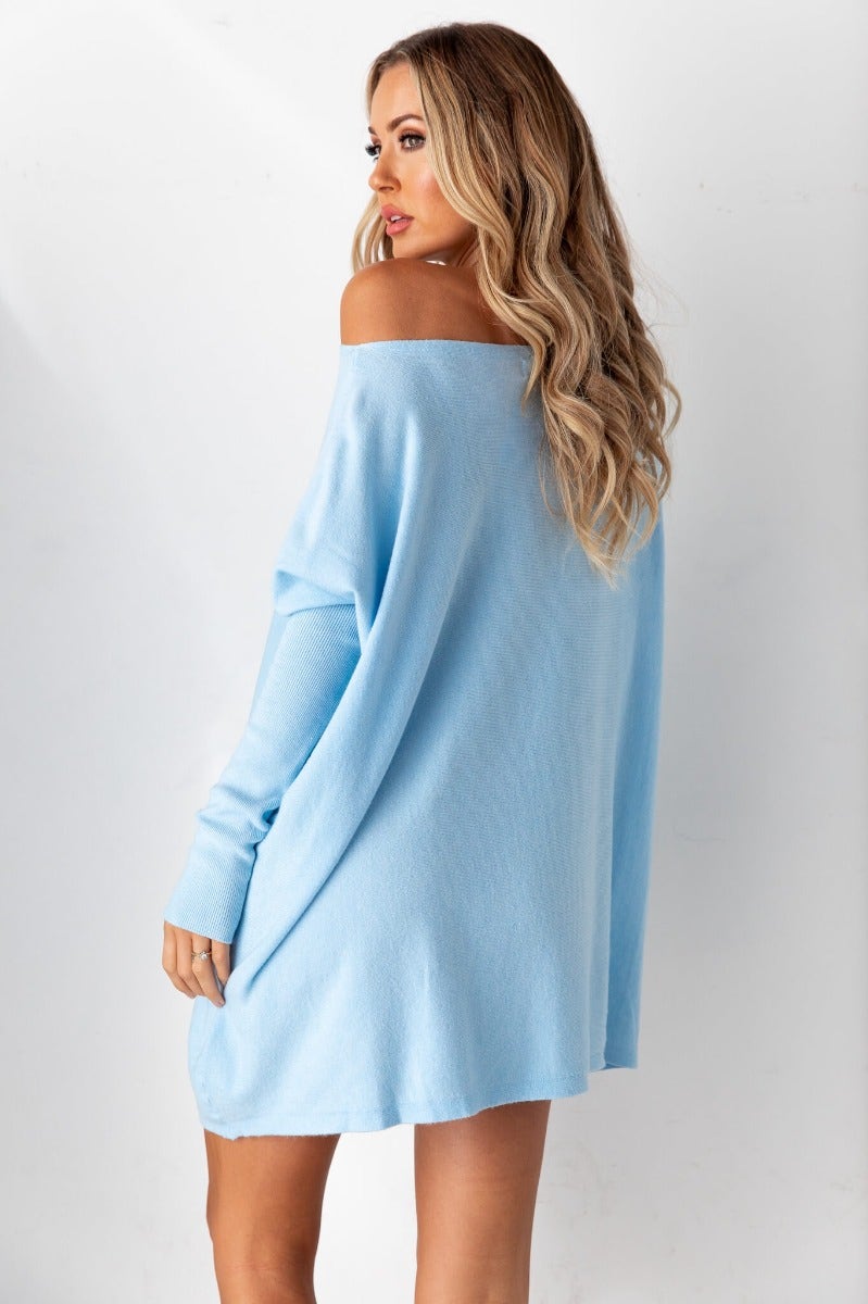 Light blue oversized Bonnie Knit top/dress with full-length sleeves and off-shoulder style.
