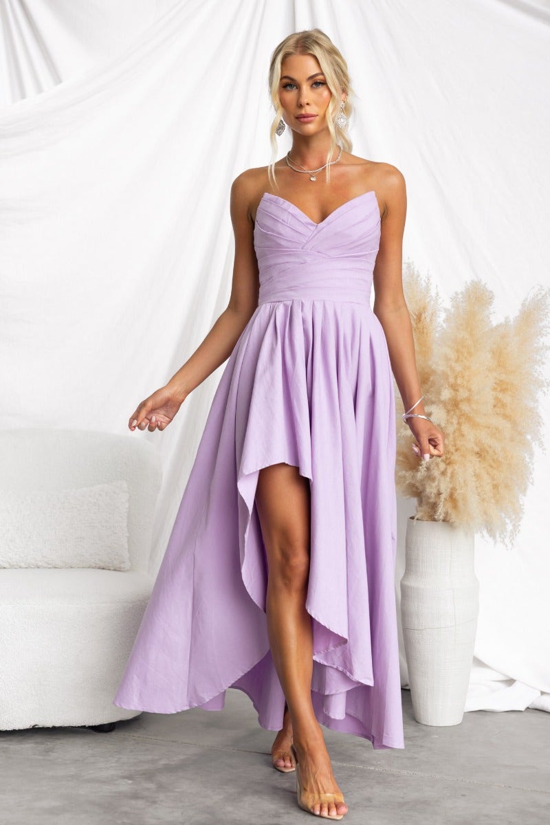Model wearing a strapless lilac Kiss And Tell Maxi Dress with an asymmetric hem and elegant styling.