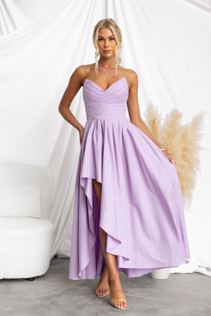 Strapless Kiss And Tell Maxi Dress in lavender with asymmetric hem and boning detail, perfect for special occasions.