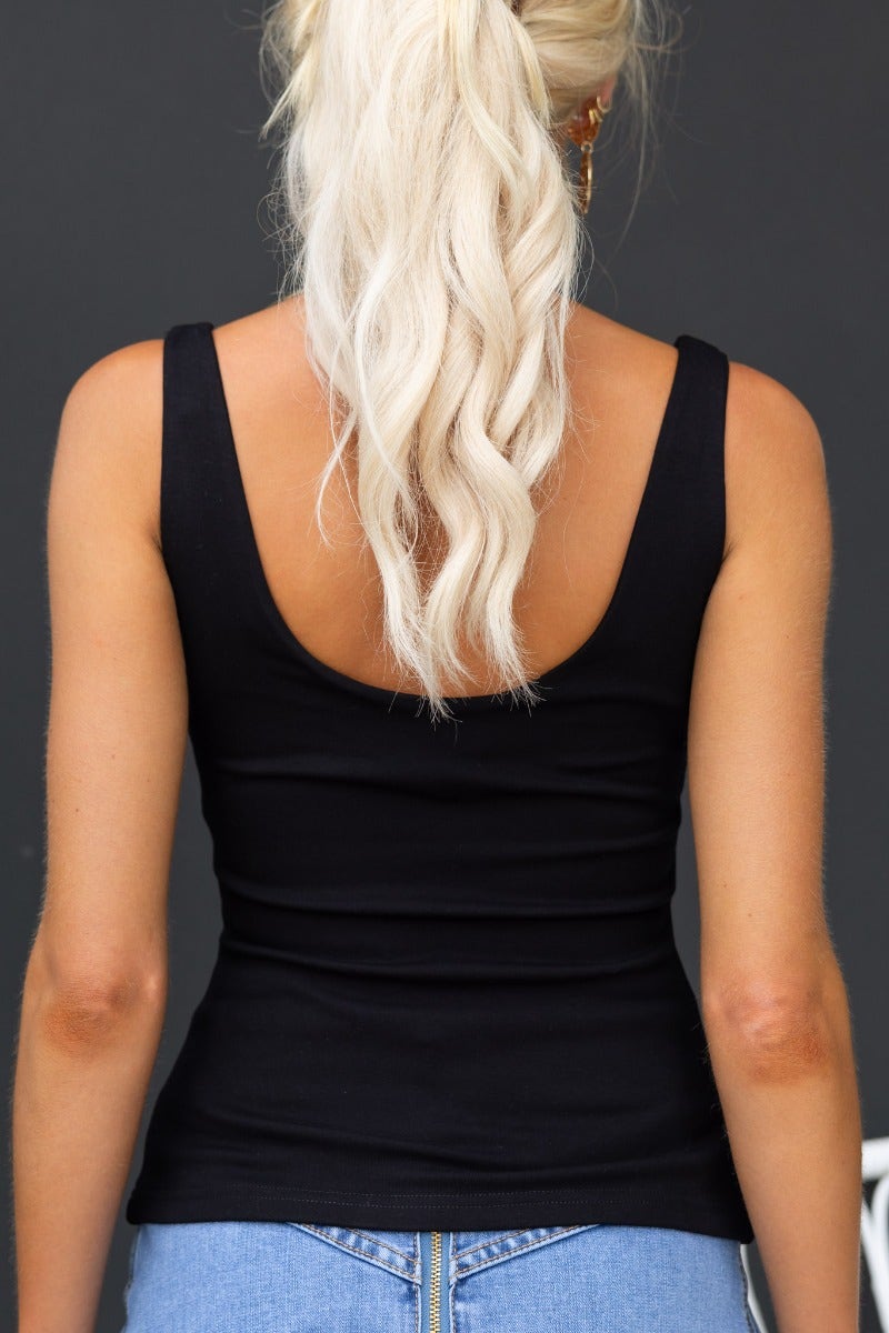 Black Cristo Top with V-neckline, featuring a fitted stretch design in a soft cotton blend.