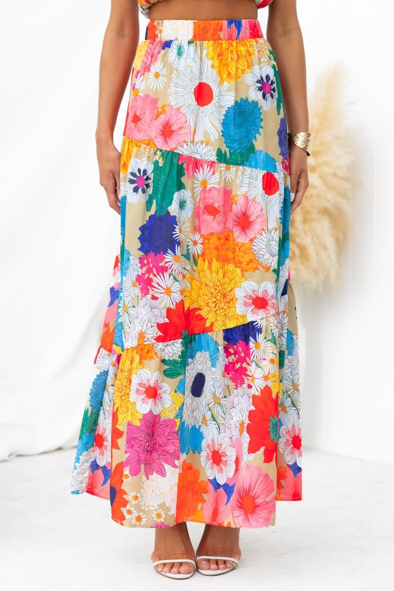 Colorful floral print maxi skirt featuring a mid-high waist, elastic waistband, and layered design.