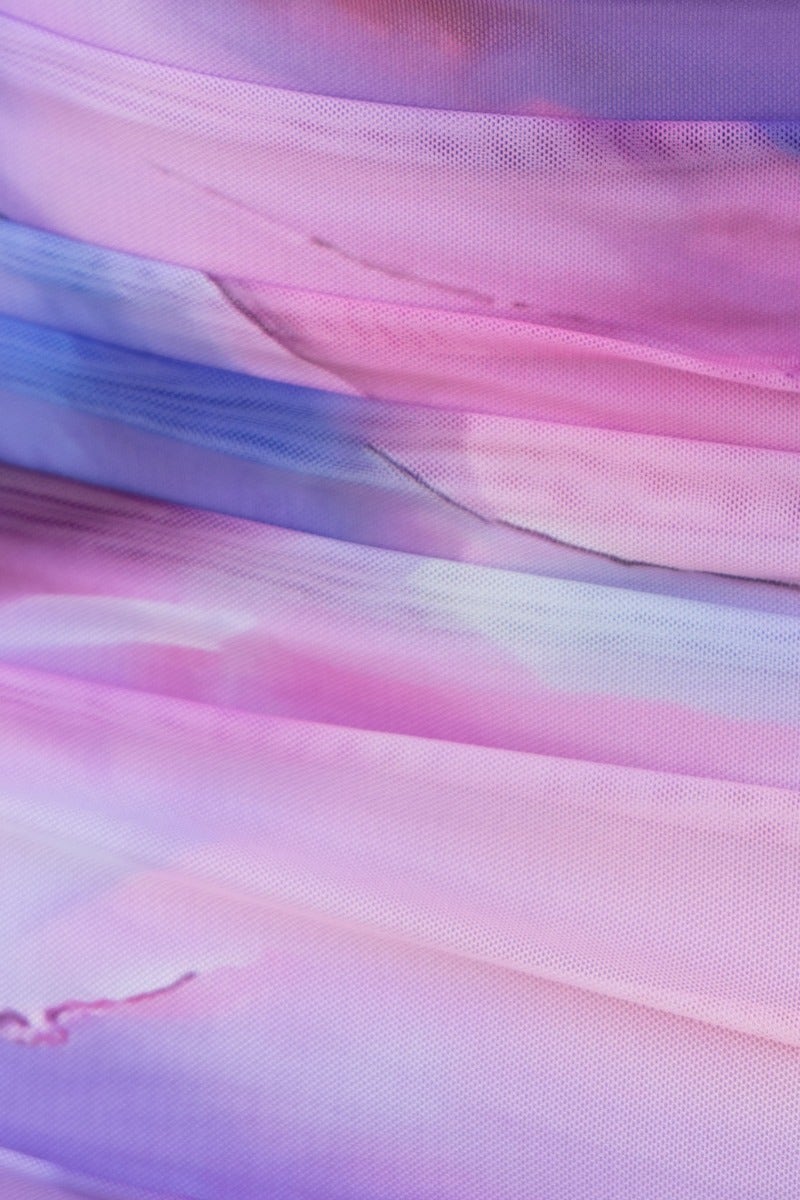 Close-up of multi-colour mesh overlay fabric featuring soft pastel pink and purple hues, ideal for Gallow dress.