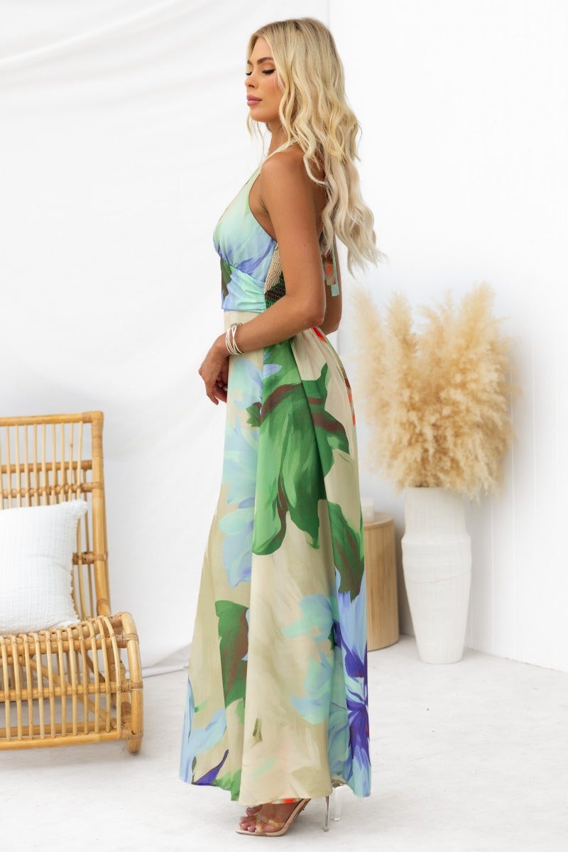 Model wearing Better Off Maxi Dress featuring floral print, adjustable neckline, and elegant silhouette.