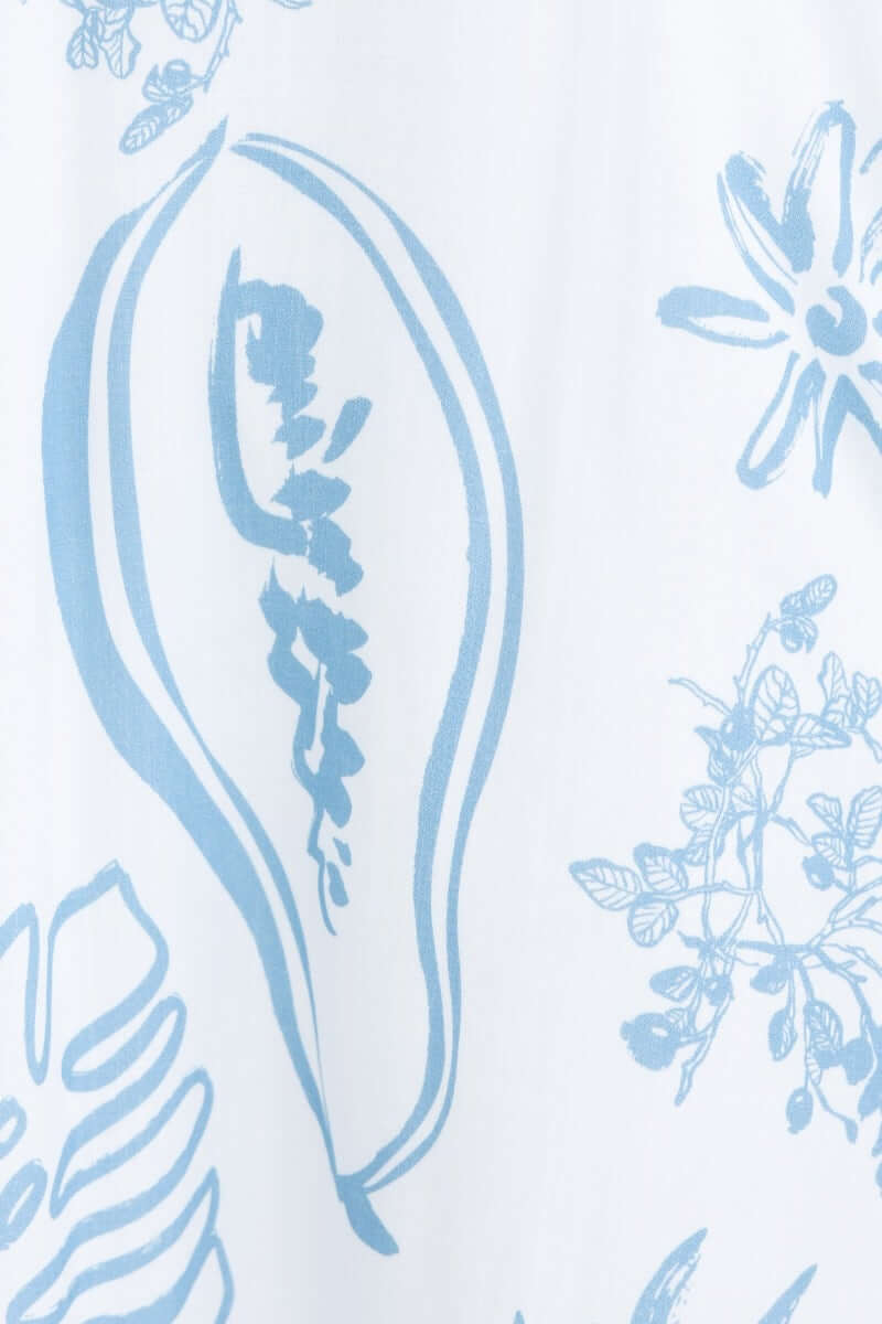 Abstract floral print in soft blue on white fabric, showcasing the elegant design of an affectionate midi dress.