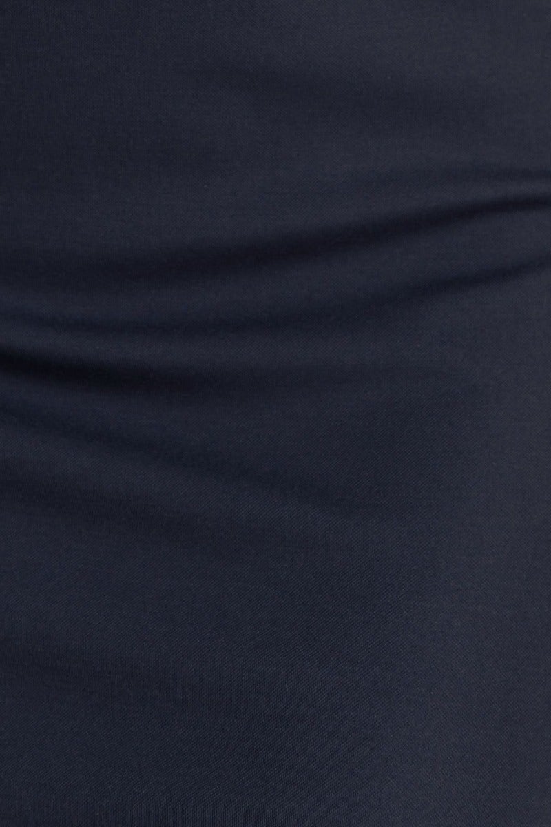 Close-up of soft navy fabric texture for the Steffi Midi Dress, showcasing its stretch and comfortable cotton feel.