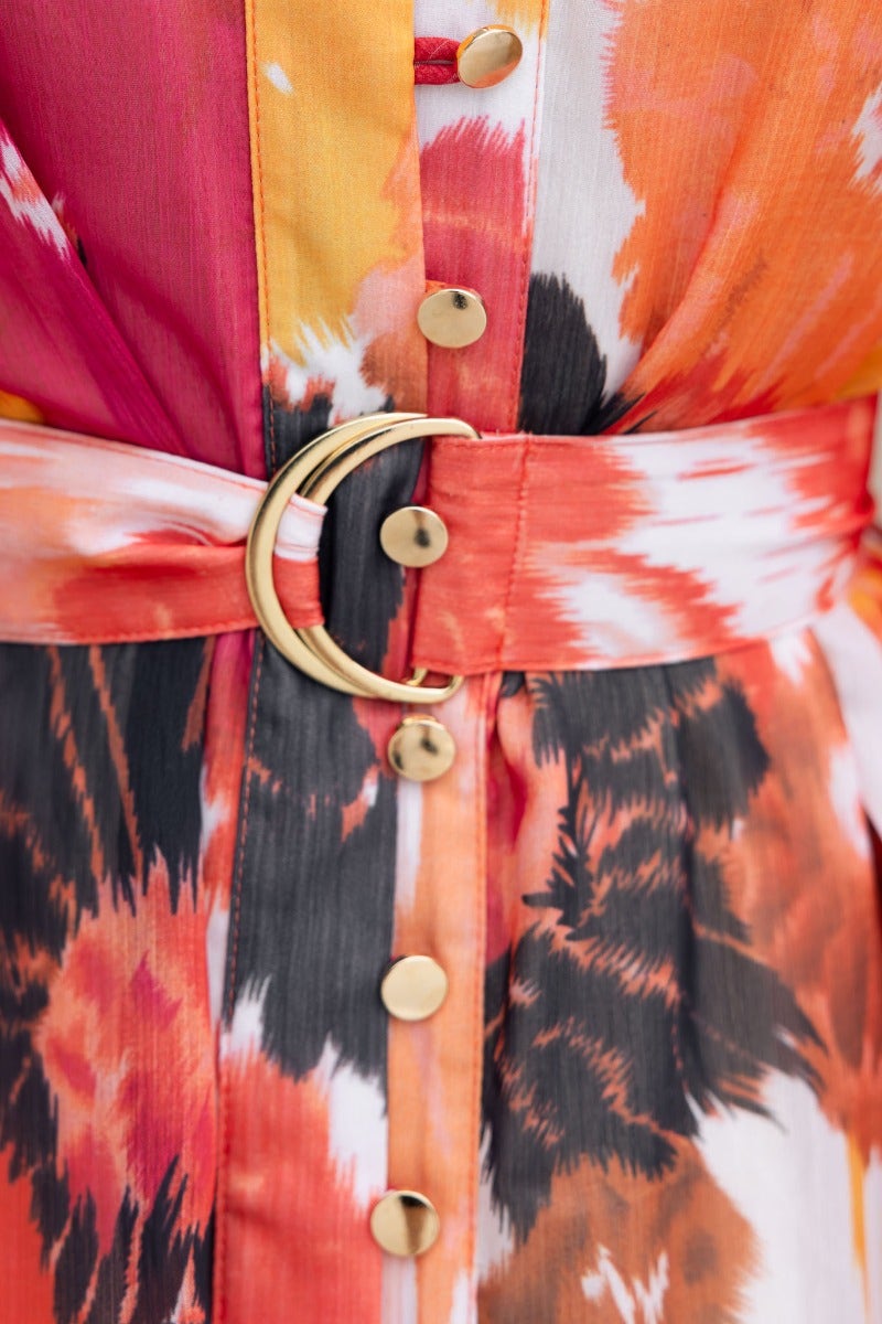 Close-up of Orazio multi-colour dress featuring a button-up front and stylish removable belt with gold buckle.
