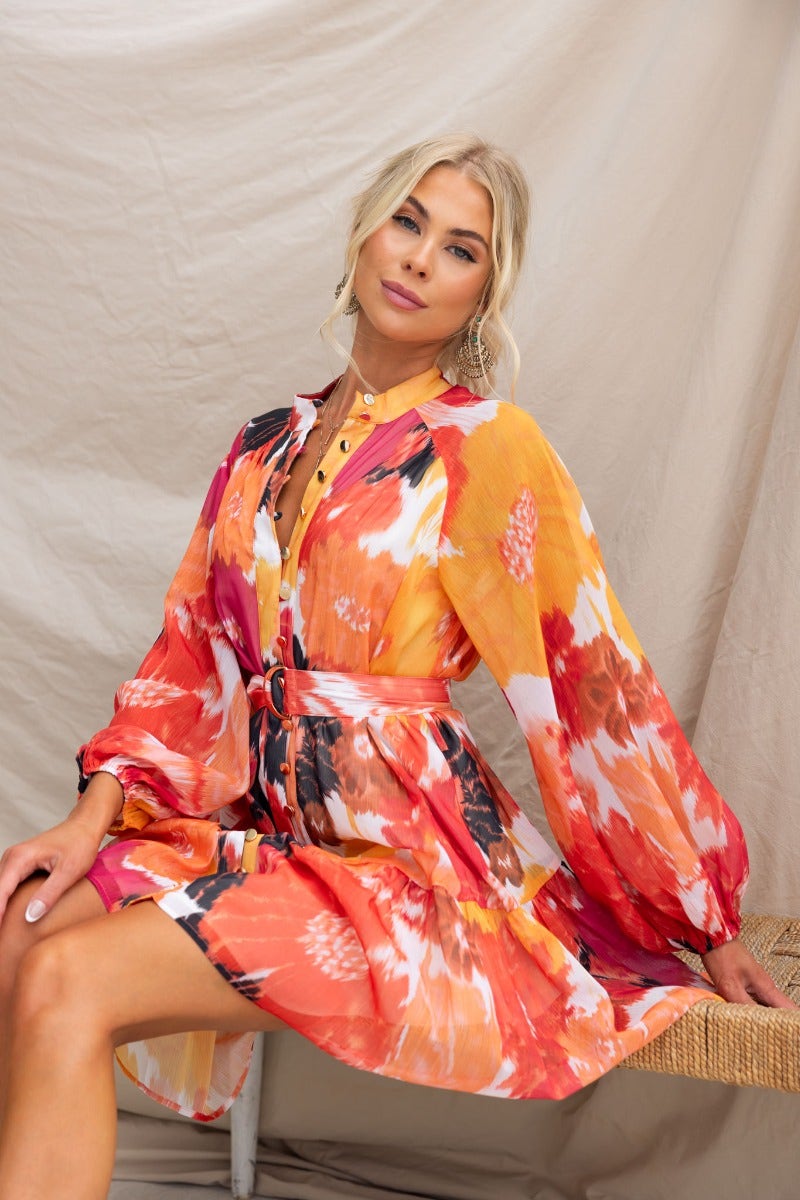 Orazio Dress multi-colour print with high neckline, button-up front, and removable belt, styled by Taylah.